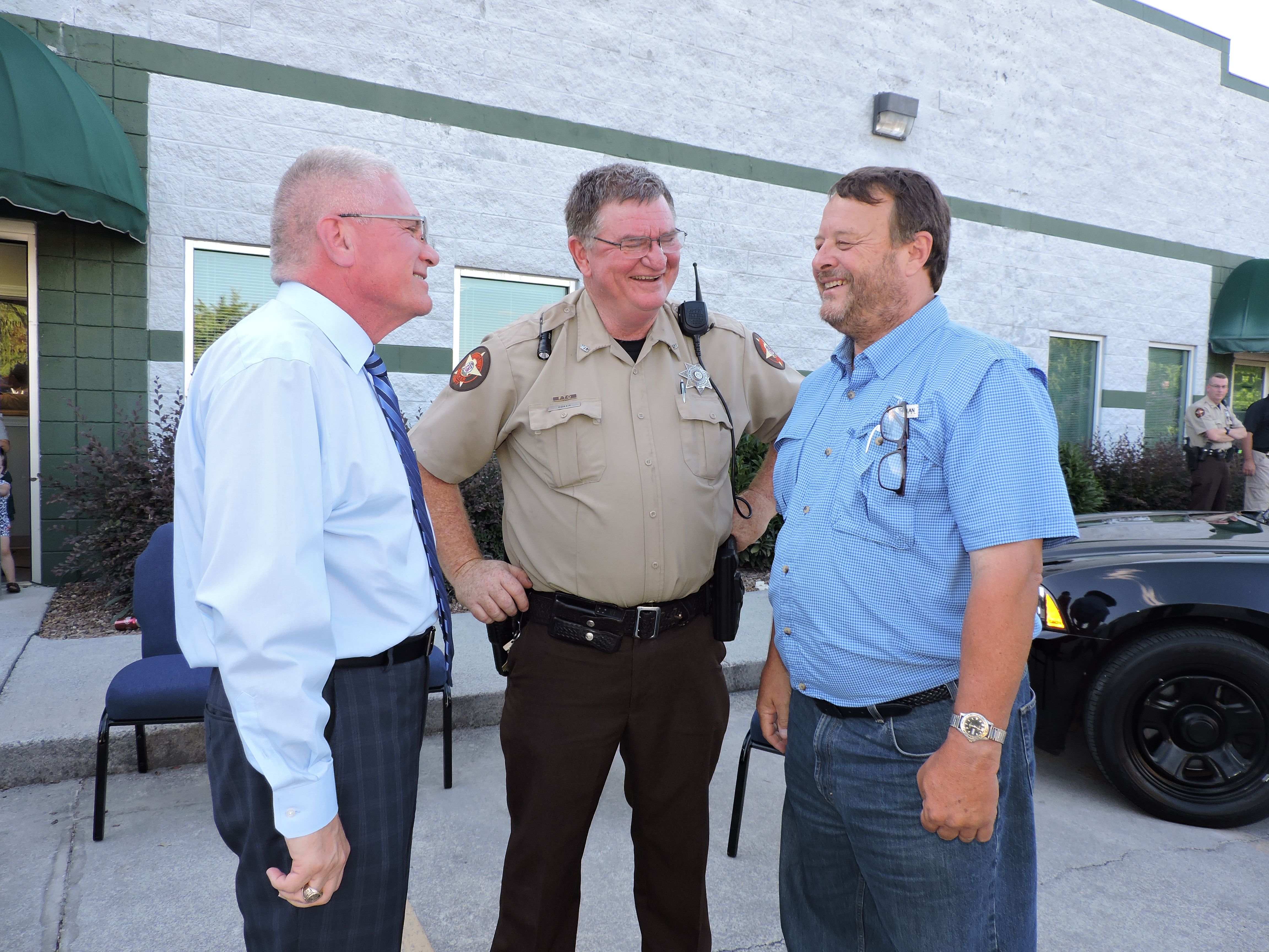 Walker County Sheriff Steve Wilson, Ridgeland High School Resource Officer Bruce Coker and Mountain View Estates modular homes subdivision owner David Roden, from left, discuss the new Walker County Sheriff's Satellite Office on Wilson Road in Rossville.