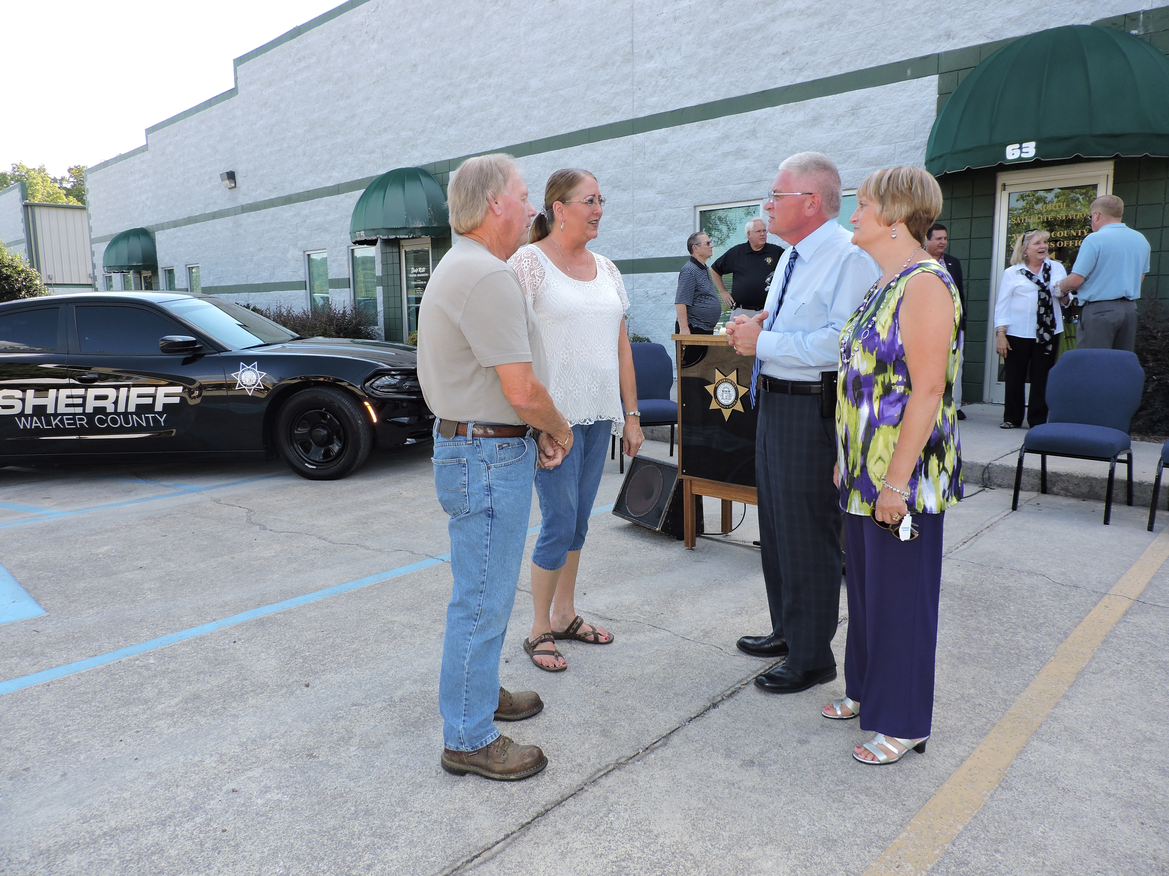 Clockwise from left, Robert and Debbie Blackwell talk to Walker County Sheriff Steve Wilson and his wife Sandy about the new Walker County Sheriff's Satellite Office on Wilson Road in Rossville.