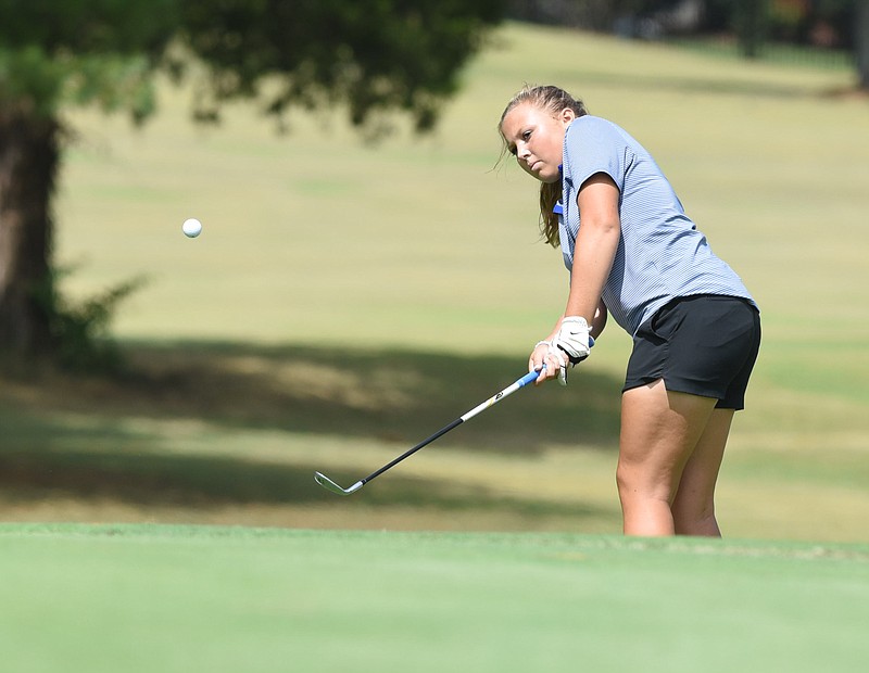 Boyd-Buchanan's Lydia Campbell chips to the 15th green Monday on her way to winning the District 5-A/AA tournament by two strokes at Chatata Valley Golf Club in Cleveland. Campbell finished with a 6-over-par 78.