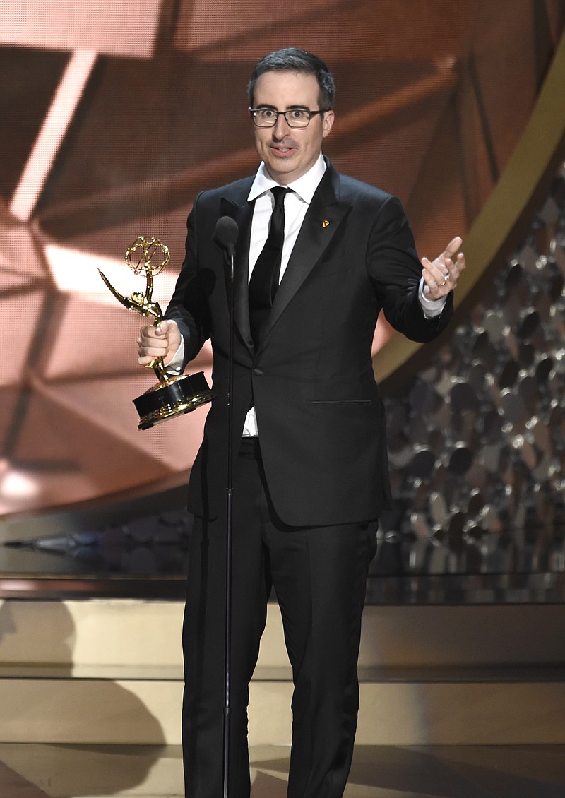 
              John Oliver of “Last Week Tonight with John Oliver” accept the award for outstanding variety talk series at the 68th Primetime Emmy Awards on Sunday, Sept. 18, 2016, at the Microsoft Theater in Los Angeles. (Photo by Chris Pizzello/Invision/AP)
            