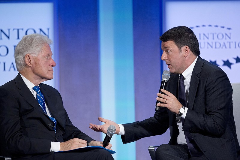 
              Former U.S. President Bill Clinton, left, and Italian Prime Minister Matteo Renzi participate in the session, "Partnering for Global Prosperity," at the Clinton Global Initiative, Monday, Sept. 19, 2016, in New York. (AP Photo/Mark Lennihan)
            