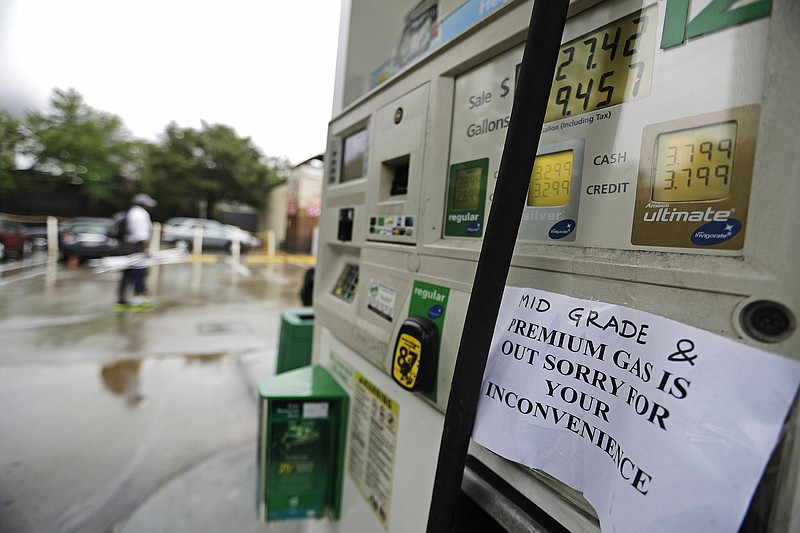 
              A gas station displays a sign informing customers it is out of certain grades of gasoline in Atlanta, Sunday, Sept. 18, 2016. Colonial Pipeline said it is beginning construction of a temporary pipeline that will bypass a leaking section of its main gasoline pipeline in Shelby County, Ala. Fuel supplies in at least five states, Alabama, Georgia, Tennessee and the Carolinas, were threatened by the spill, and the U.S. Department of Transportation ordered the company responsible to take corrective action before the fuel starts flowing again. (AP Photo/David Goldman)
            