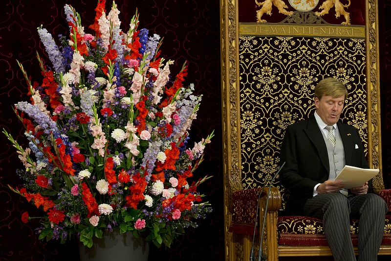 
              Dutch King Willem-Alexander reads the speech outlining the Dutch government's budget plans for the year ahead in the Knight's Hall in The Hague, Netherlands, Tuesday, Sept. 20, 2016. (AP Photo/Peter Dejong)
            