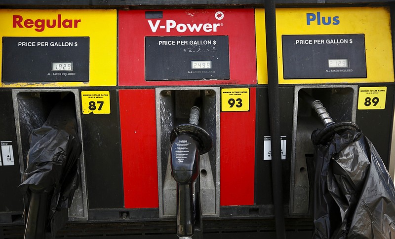 
              Plastic bags covering gas pumps informs customers of a gas outage at a station in Alabaster, Ala., on Monday, Sept. 19, 2016, Alabama Gov. Robert Bentley issued a state of emergency after a pipeline spill near Helena, Ala. Gas prices spiked and drivers found "out of service" bags covering pumps as the gas shortage in the South rolled into the work week, raising fears that the disruptions could become more widespread. (AP Photo/Brynn Anderson)
            