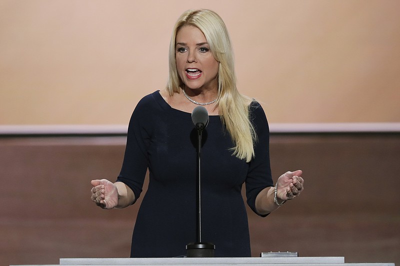 
              FILE - In this July 20, 2016 file photo, Florida Attorney General Pam Bondi speaks at the Republican National Convention in Cleveland. Bondi on Tuesday, Sept. 20, 2016, defended her decision three years ago to solicit $25,000 from Donald Trump at the same time questions were arising about Trump University. (AP Photo/J. Scott Applewhite, File)
            