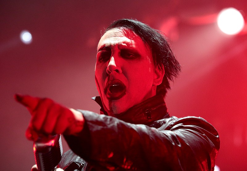
              FILE - In this Aug. 2, 2015 file photo, Marilyn Manson performs in concert during the “End Times Tour 2015” at the Susquehanna Bank Center, in Camden, N.J. Manson isn't supporting either presidential candidate. The shock rock star tells Rolling Stone magazine that he has no intention of voting for either Hillary Clinton or Donald Trump in the 2016 November election. (Photo by Owen Sweeney/Invision/AP, File)
            