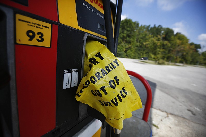
              A yellow bag reads "sorry temporarily out of service" informing customers of a gas outage at a station in Alabaster, Ala., on Monday, Sept. 19, 2016, Alabama Gov. Robert Bentley issued a state of emergency after a pipeline spill near Helena, Ala. Gas prices spiked and drivers found "out of service" bags covering pumps as the gas shortage in the South rolled into the work week, raising fears that the disruptions could become more widespread. (AP Photo/Brynn Anderson)
            