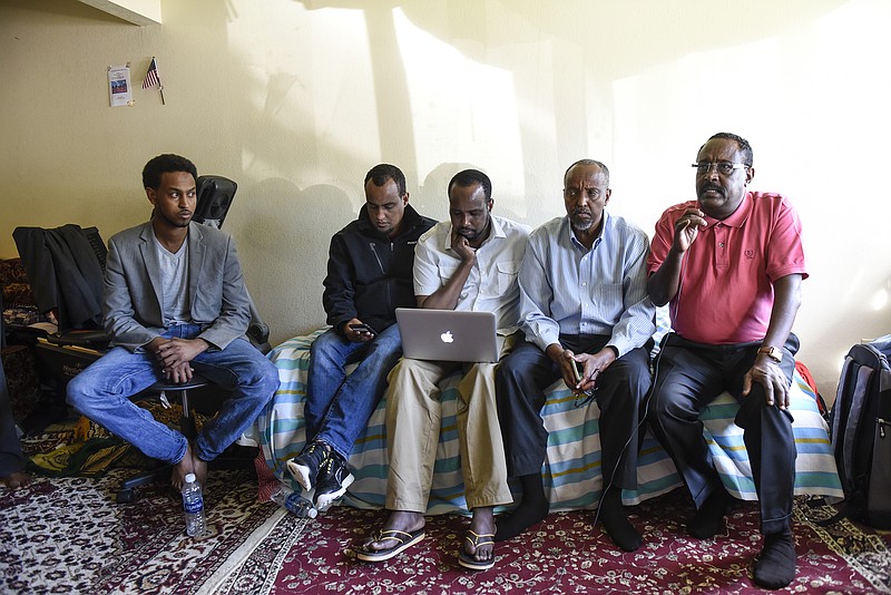 
              Somali-American leaders hold a press conference Sunday, Sept. 18, 2016, in St. Cloud, Minn.,  to address the stabbing and shooting incident that happened Saturday at Crossroads Center Mall. A man in a private security uniform stabbed nine people at a Minnesota shopping mall Saturday, reportedly asking one victim if they were Muslim before an off-duty police officer shot and killed him in an attack the Islamic State group claimed as its own. (Dave Schwarz/St. Cloud Times via AP)
            