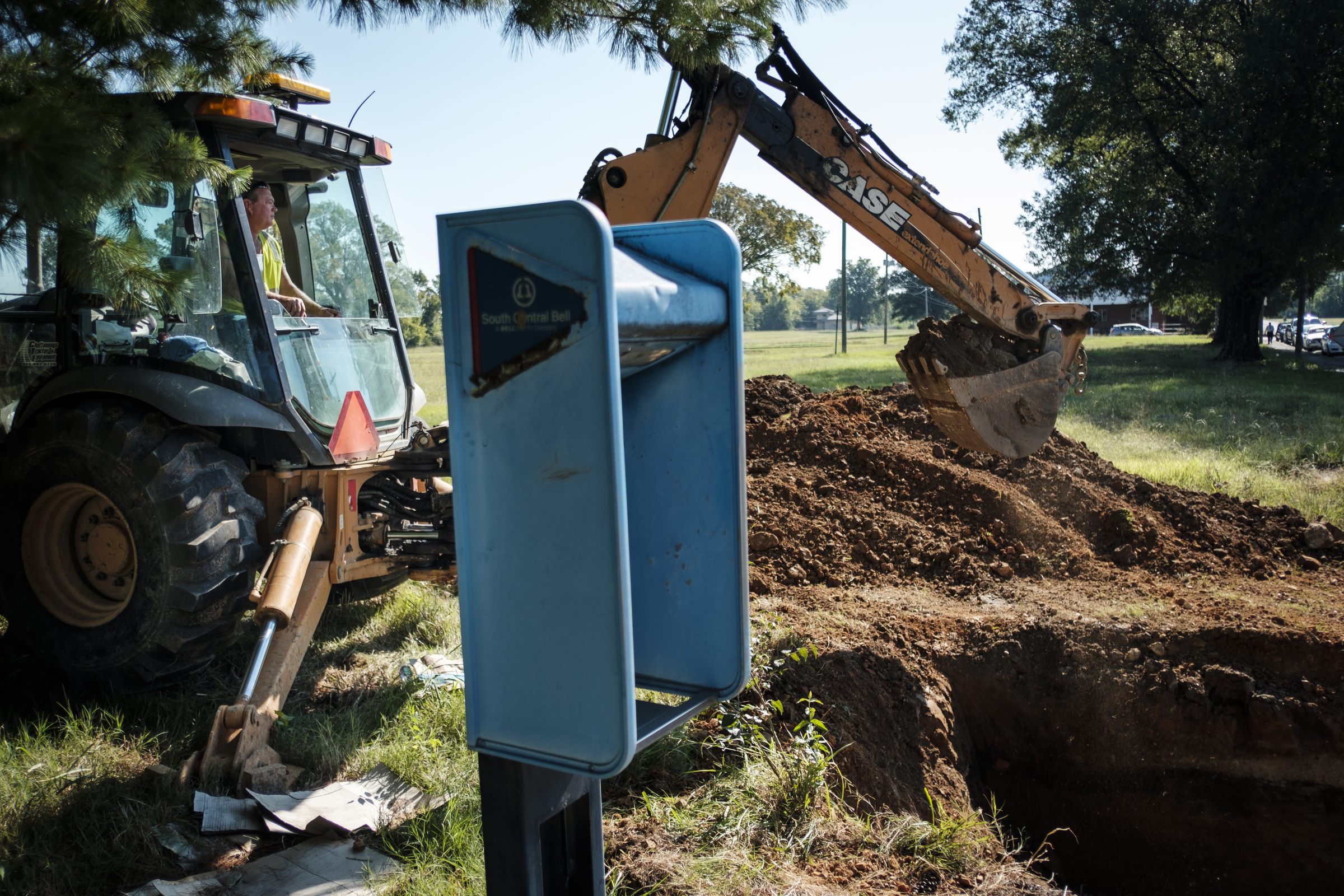 Tennessee American Water worker Jack Derryberry uses an excavator to take an old water main out of service so new construction can begin at the old site of Maurice Poss Homes near Howard School on Wednesday, Sept. 21, 2016, in Chattanooga, Tenn. Officials hope to use the site to build a new stadium for Howard.