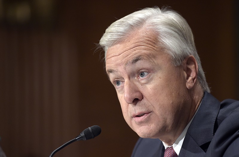 
              FILE - In this Tuesday, Sept. 20, 2016 file photo, Wells Fargo Chief Executive Officer John Stumpf testifies on Capitol Hill in Washington, before the Senate Banking Committee. Facing bipartisan outrage from a Senate panel over accusations of employee misconduct, Stumpf appeared taken aback by the intensity of the verbal lashing. He bristled at assertions that the alleged opening of millions of customer accounts without their permission was a "scam." (AP Photo/Susan Walsh, File)
            