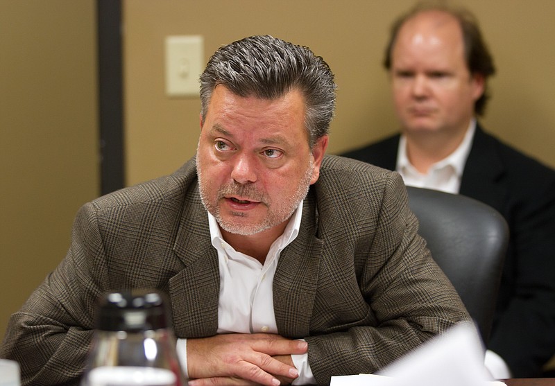 
              FILE - In this Oct. 23, 2012, file photo, Republican donor Andy Miller, left, and brother Tracy Miller listen to proceedings at a meeting of the Tennessee Registry of Election Finance in Nashville, Tenn. The Millers on Sept. 13, 2016, agreed to pay $7.8 million to settle allegations of defrauding a federal military health care program (AP Photo/Erik Schelzig)
            