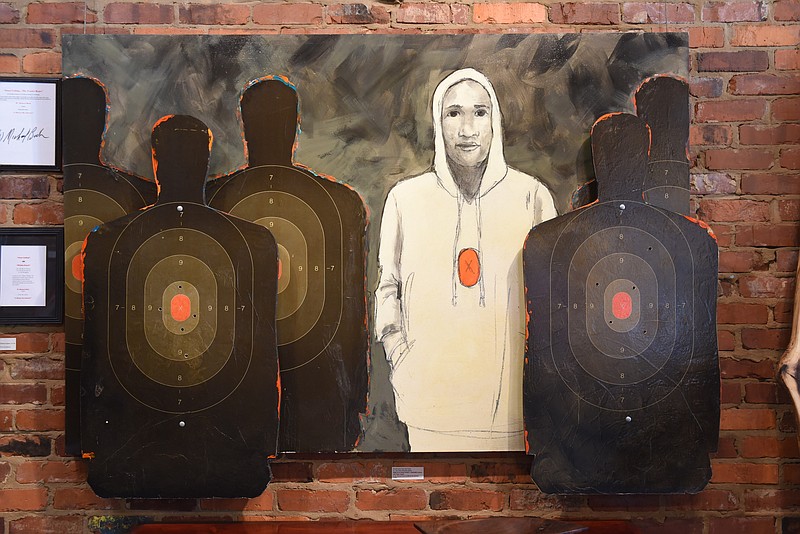 "Portrait of an Inner City Youth," also known as "The Urban Shooting Gallery," was created by W. Michael Bush for his series "A Mirror on America."