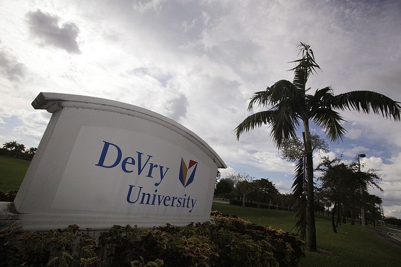
              FILE - This Nov. 24, 2009, file photo, shows the entrance to the DeVry University in Miramar, Fla. Some of the nation’s largest for-profit college chains are suffering steep declines in enrollment amid heavier government scrutiny. DeVry University says the number of students taking classes is down 23 percent this year, and the University of Phoenix is off 22 percent. (AP Photo/J Pat Carter, File)
            