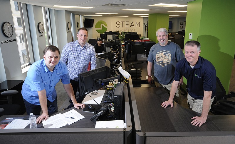 Staff photo by Tim Barber The Steam Logistics management team includes, from left, Brook Cummings, director of exports; Jason Provonsha, chief executive officer; Steve Smith, vice president of customs brokerage, and Steve Cox, president and chief operating officer.