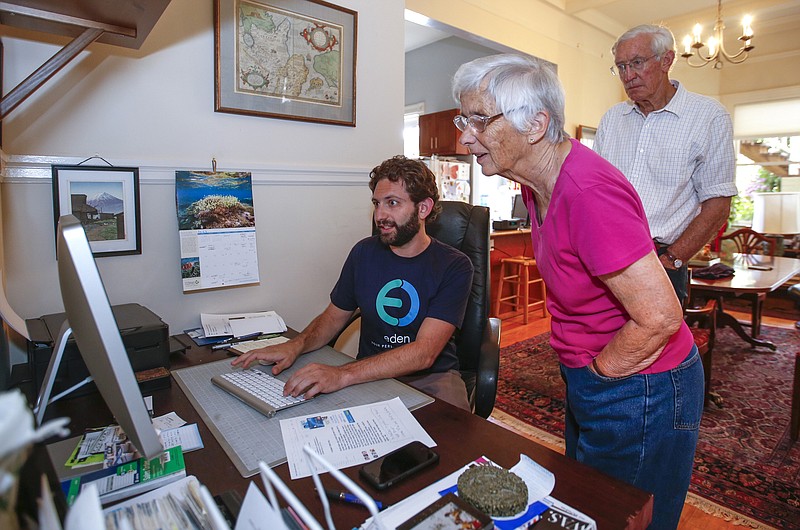 Repair technician Ronen Sberlo, left, helps Bill Bastik, 80, and his wife Sarah Bastik, 78, with a problem on their home computer. There are times when you need someone like Sberlo to fix a computer issue. (John Green/Bay Area News Group)