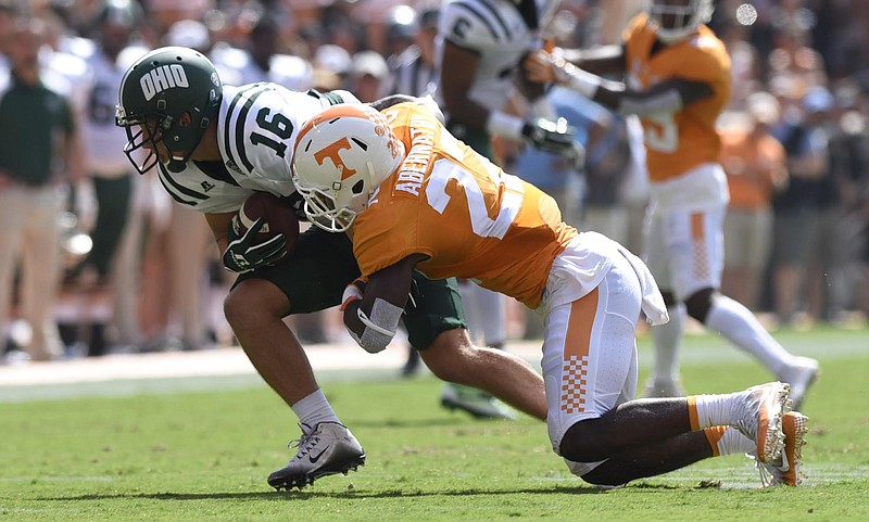 Tennessee's Micah Abernathy (22) tackles Ohio's Kyle Belack in last Saturday's win for Tennessee at Neyland Stadium. The Volunteers will be back there today to begin SEC play against East Division nemesis Florida.