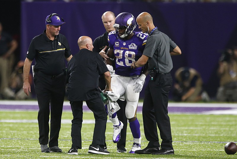 Vikings put Peterson on IR; Kalil has labral surgery on hip