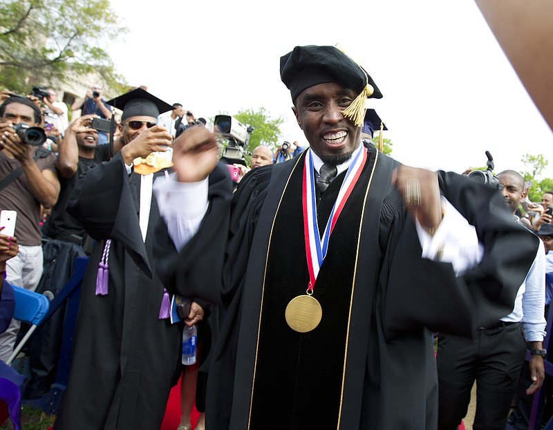 
              FILE - In this May 10, 2014, file photo, entertainer and entrepreneur Sean "Puff Daddy" Combs arrives to the 2014 Howard University graduation ceremony at Howard University in Washington. Combs announced a $1 million donation to the school on Sept. 23, 2016, during his concert in Washington. (AP Photo/Jose Luis Magana, File)
            