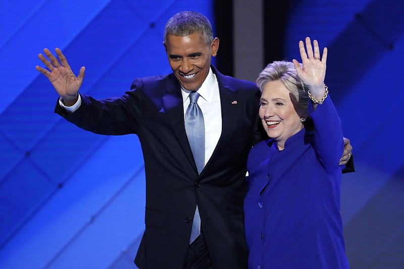 
              FILE - In this July 27, 2016 file photo, President Barack Obama and Democratic presidential nominee Hillary Clinton wave to delegates after President Obama's speech during the third day of the Democratic National Convention in Philadelphia. Hillary Clinton long planned to activate the much-vaunted Obama coalition to carry her to the White House. But a rough month on the trail has exposed a big challenge, the Obama coalition belongs to Barack Obama.  (AP Photo/J. Scott Applewhite, File)
            