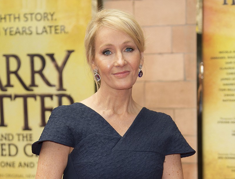 
              FILE - In this July 30, 2016, file photo, writer J.K. Rowling poses for photographers upon arrival at gala performance of "Harry Potter and the Cursed Child," in central London. Rowling clarified on Sept. 22, 2016, that slain Ohio gorilla, Harambe, is not a part of her fictional universe. The comment on Twitter came after Rowling retweeted a fake photo of Harambe as a result on the Patronus page of her Pottermore website. (Photo by Joel Ryan/Invision/AP, File)
            