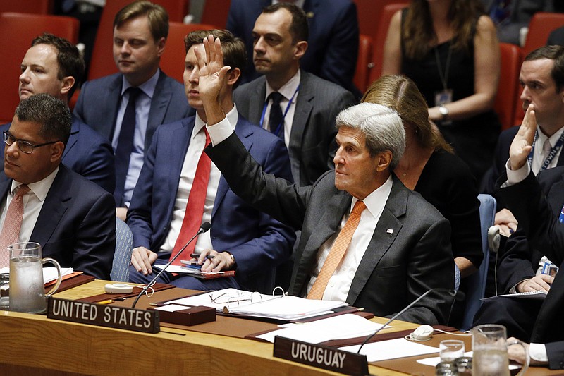 
              United States Secretary of State John Kerry votes to adopt a resolution regarding the Comprehensive Nuclear Test Ban Treaty during a meeting of the United Nations Security Council at U.N. headquarters, Friday, Sept. 23, 2016. (AP Photo/Jason DeCrow)
            