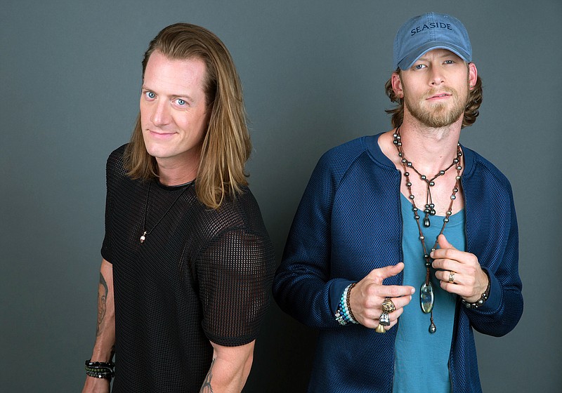 
              In this Aug. 25, 2016 photo, Tyler Hubbard, left, and Brian Kelley of Florida Georgia Line pose for a portrait in New York to promote their latest album, "Dig Your Roots. (Photo by Amy Sussman/Invision/AP, File)
            