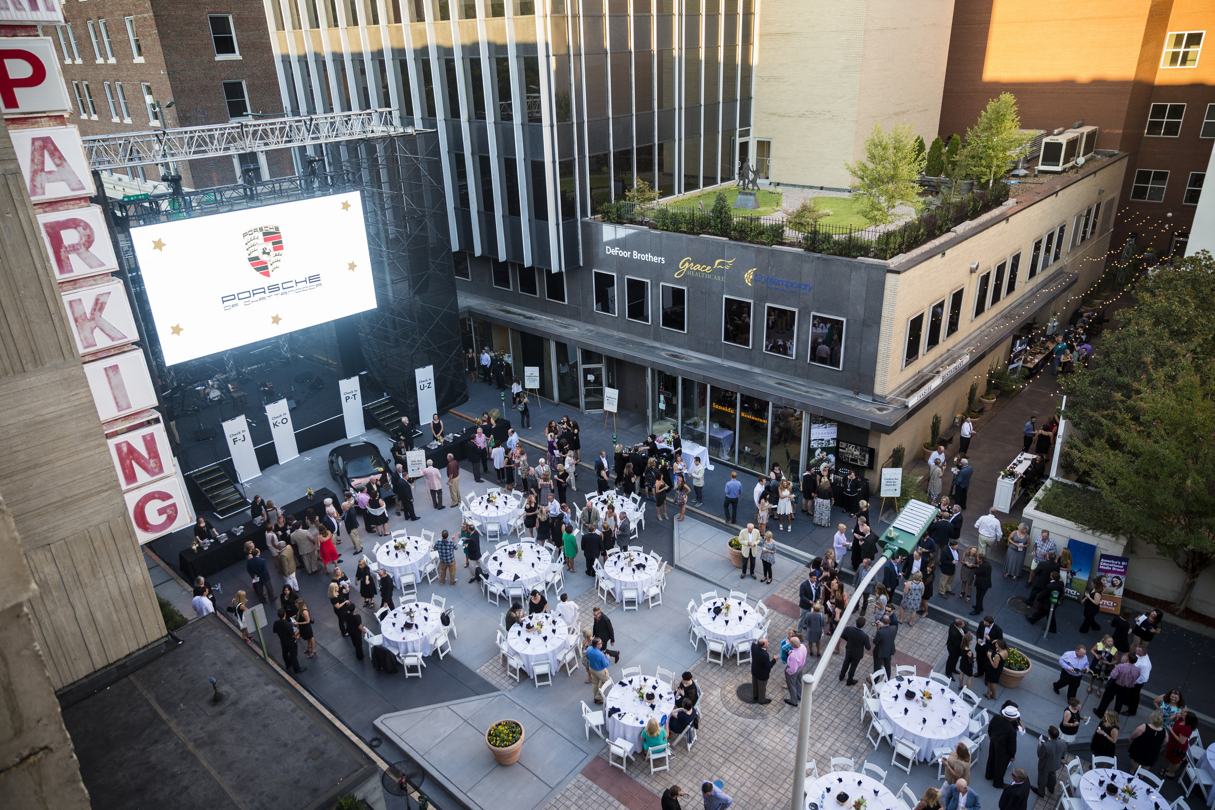 People attend the "Remembering the Past, Celebrating the Future" fundraiser to raise money for WTCI held on the newly repaved section of Chestnut Street between Martin Luther King, Jr., Boulevard and 8th Street on Saturday, Sept. 24, 2016, in Chattanooga, Tenn. The fundraiser featured music from Arlo Guthrie, the Dismembered Tennesseans, and Priscilla and Little Rickee.