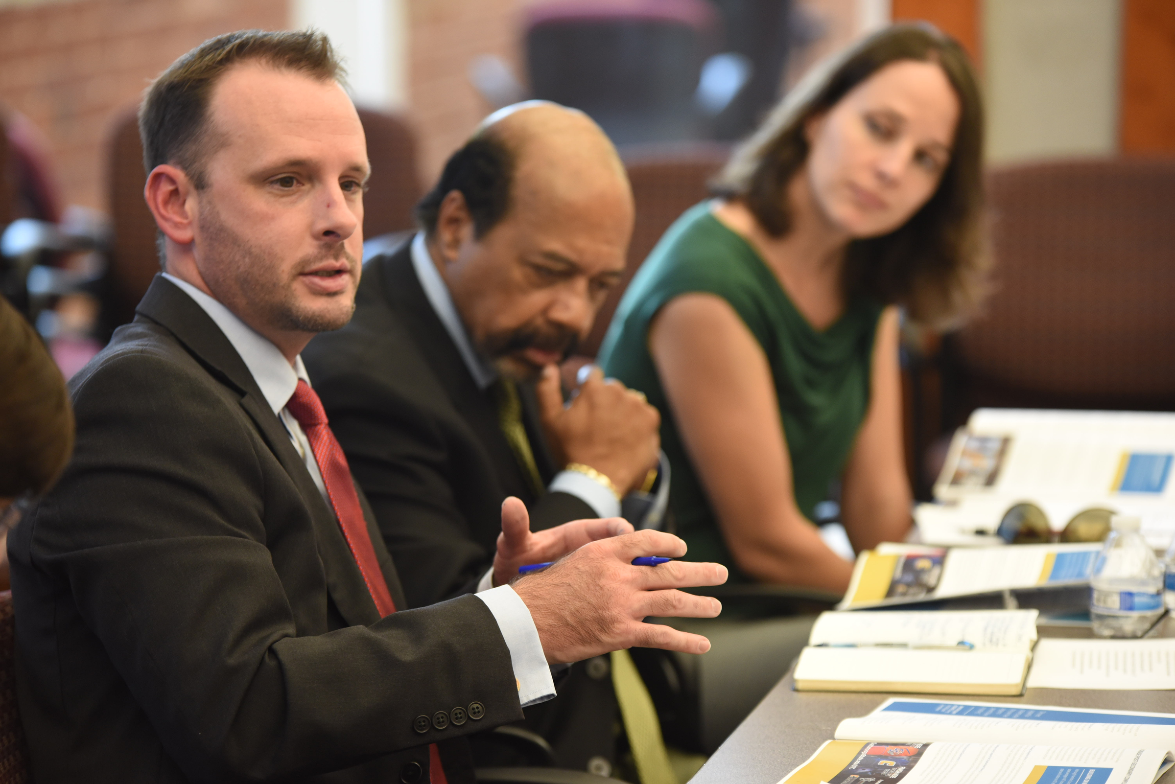 Jared Bigham talks about Chatt 2.0 in a meeting Friday at the Times Free Press. Warren Logan, center, and Keri Randolph listen to Bigham's comments.
