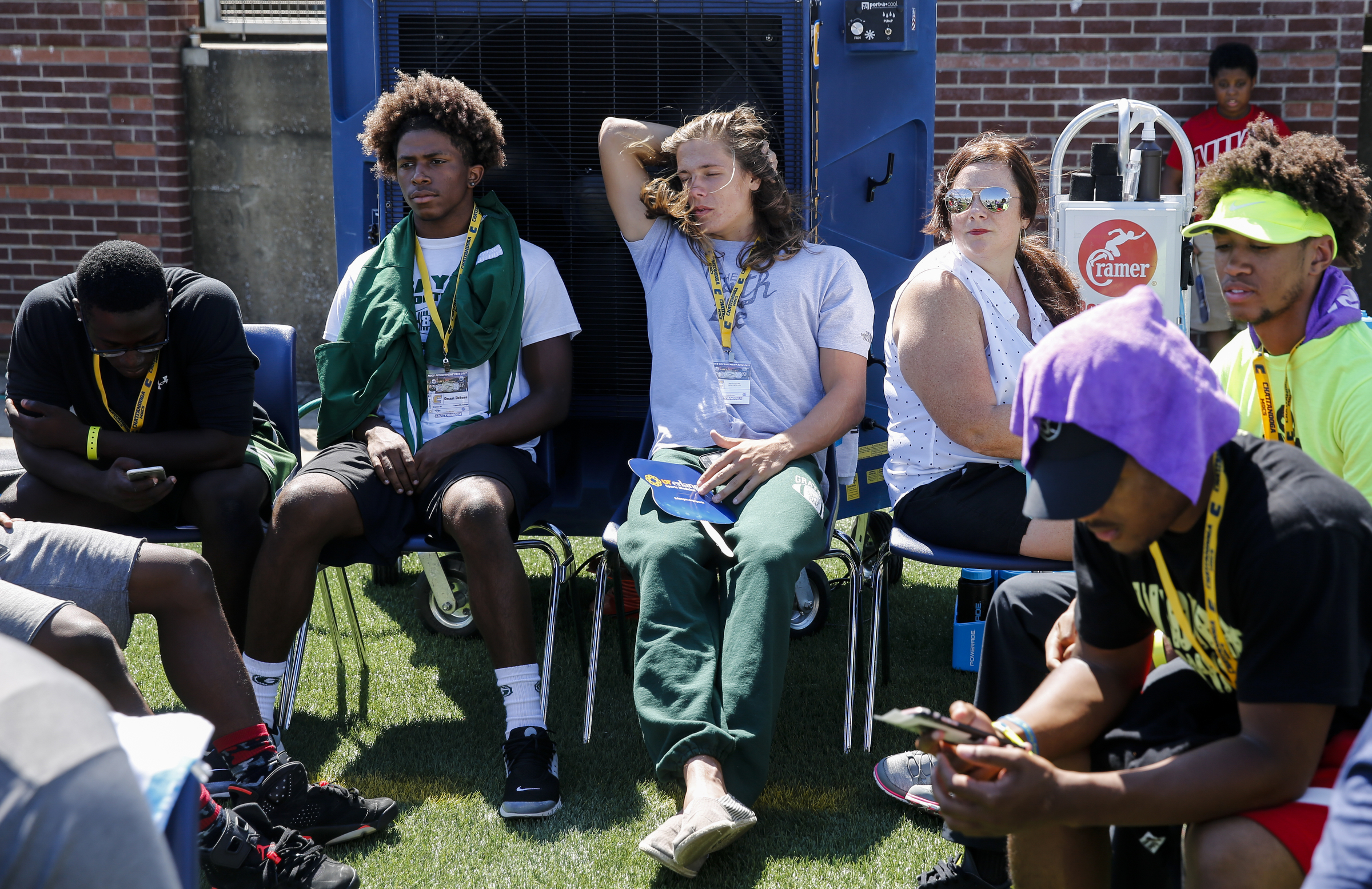 High schoolers looking at UTC try to stay cool in front of the field air conditioner before the Mocs' home football game against the Samford Bulldogs at Finley Stadium on Saturday, Sept. 24, 2016, in Chattanooga, Tenn.