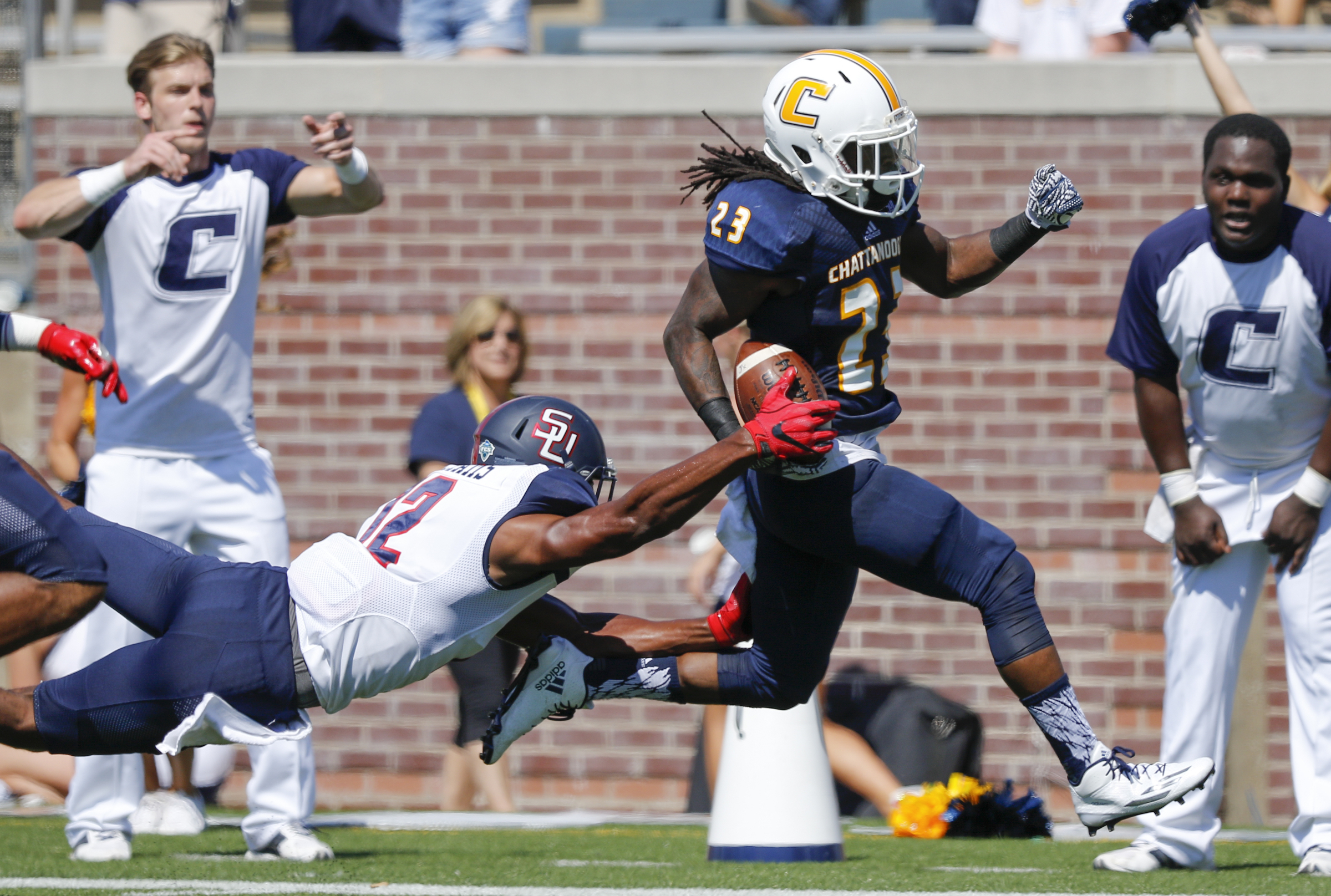 Samford defensive back Omari Williams strips the ball from UTC running back Richardre Bagley at the goal line during the Mocs' home football game against the Bulldogs at Finley Stadium on Saturday, Sept. 24, 2016, in Chattanooga, Tenn. Bagley recovered the fumble for a touchdown in the end zone.