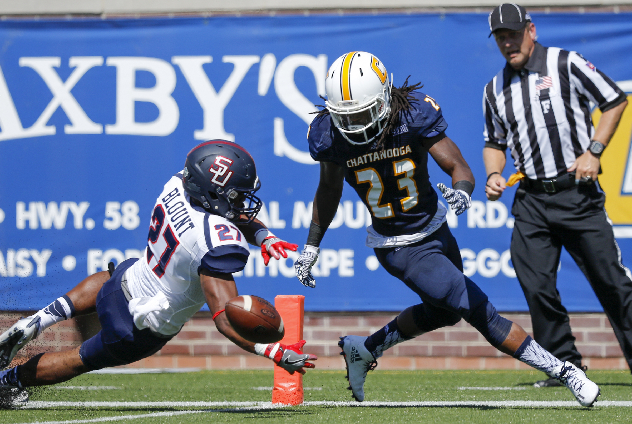 Samford safety Jamerson Blount, left, and UTC running back Richardre Bagley fall on Bagley's fumbled ball in the end zone during the Mocs' home football game against the Bulldogs at Finley Stadium on Saturday, Sept. 24, 2016, in Chattanooga, Tenn. Bagley recovered in the end zone for a touchdown.
