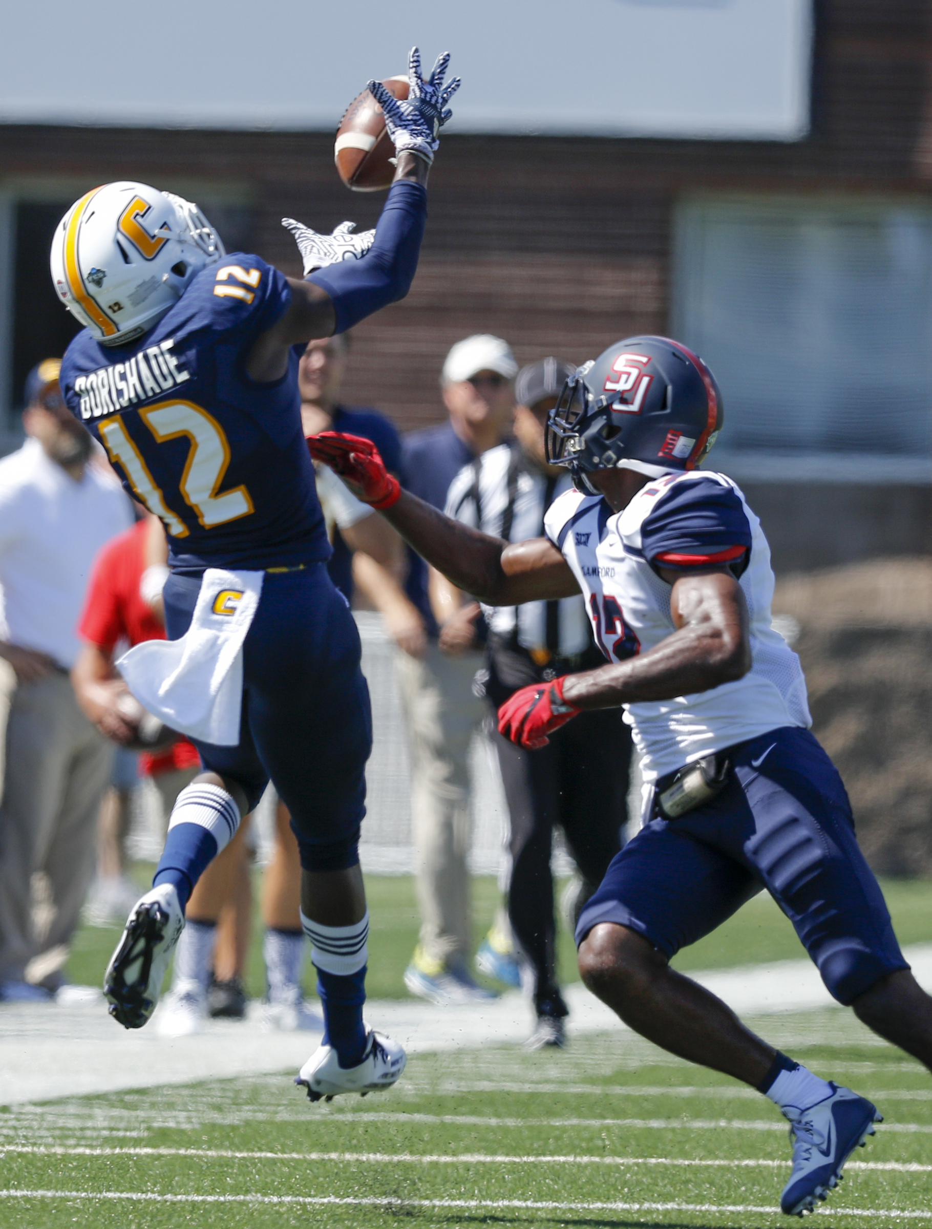 UTC wide receiver Xavier Borishade catches a pass ahead of Samford defensive back Omari Williams during the Mocs' home football game against the Bulldogs at Finley Stadium on Saturday, Sept. 24, 2016, in Chattanooga, Tenn.