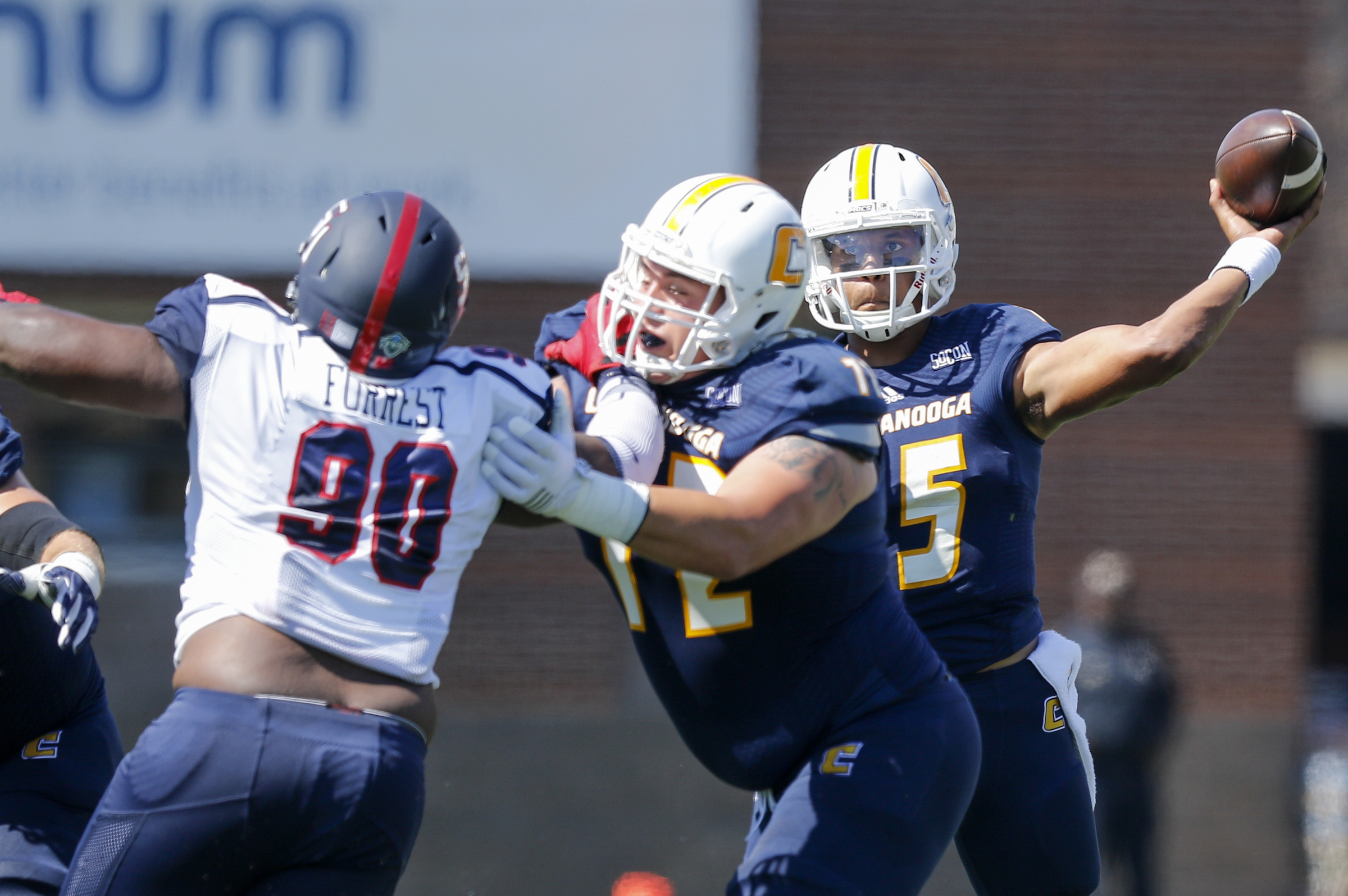 UTC offensive lineman Josh Cardiello blocks Samford defensive lineman Xavier Forrest as quarterback Alejandro Bennifield passes during the Mocs' home football game against the Bulldogs at Finley Stadium on Saturday, Sept. 24, 2016, in Chattanooga, Tenn.