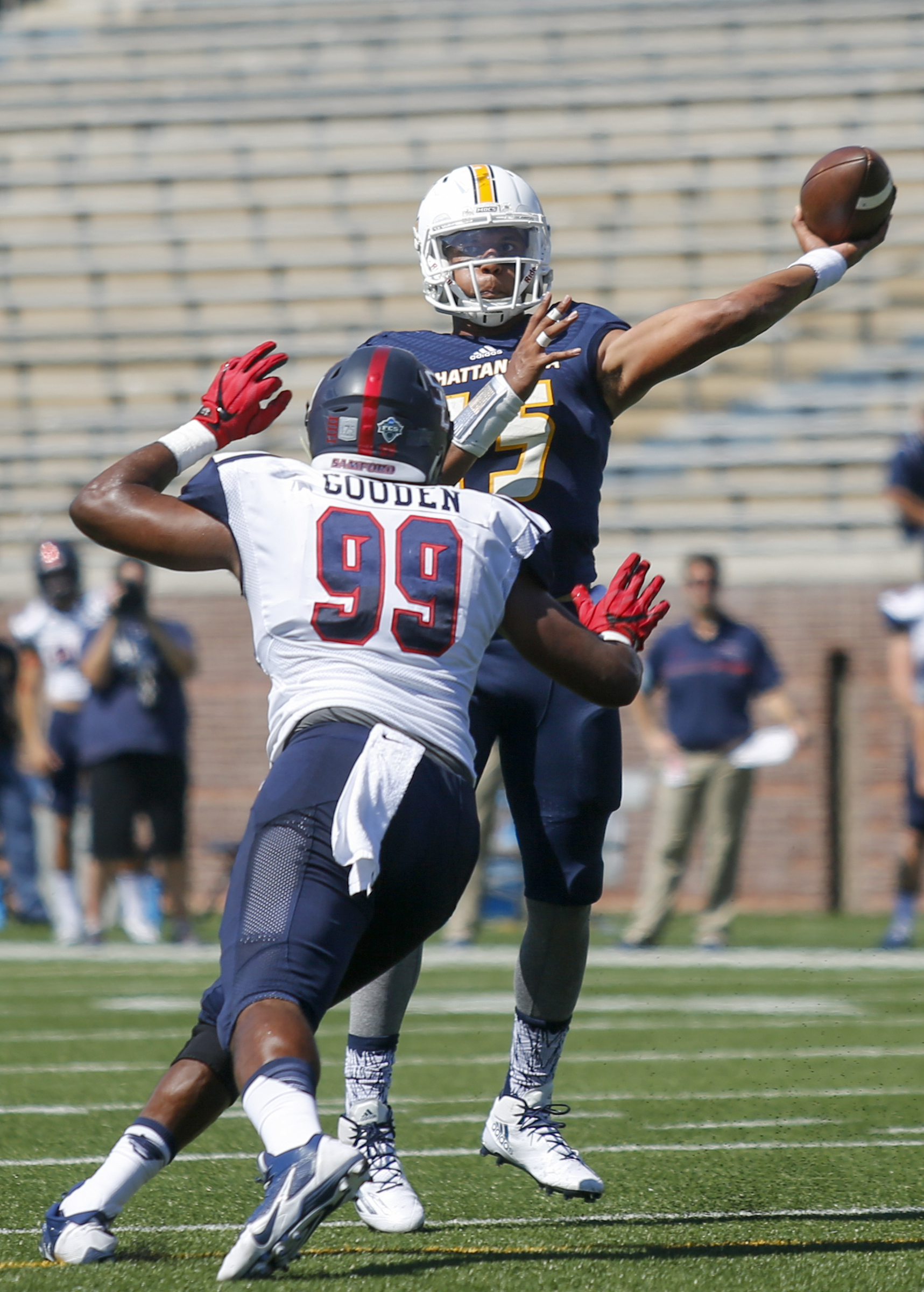 UTC quarterback Alejandro Bennifield passes against coverage by Samford defensive lineman Ahmad Gooden during the Mocs' home football game against the Bulldogs at Finley Stadium on Saturday, Sept. 24, 2016, in Chattanooga, Tenn.