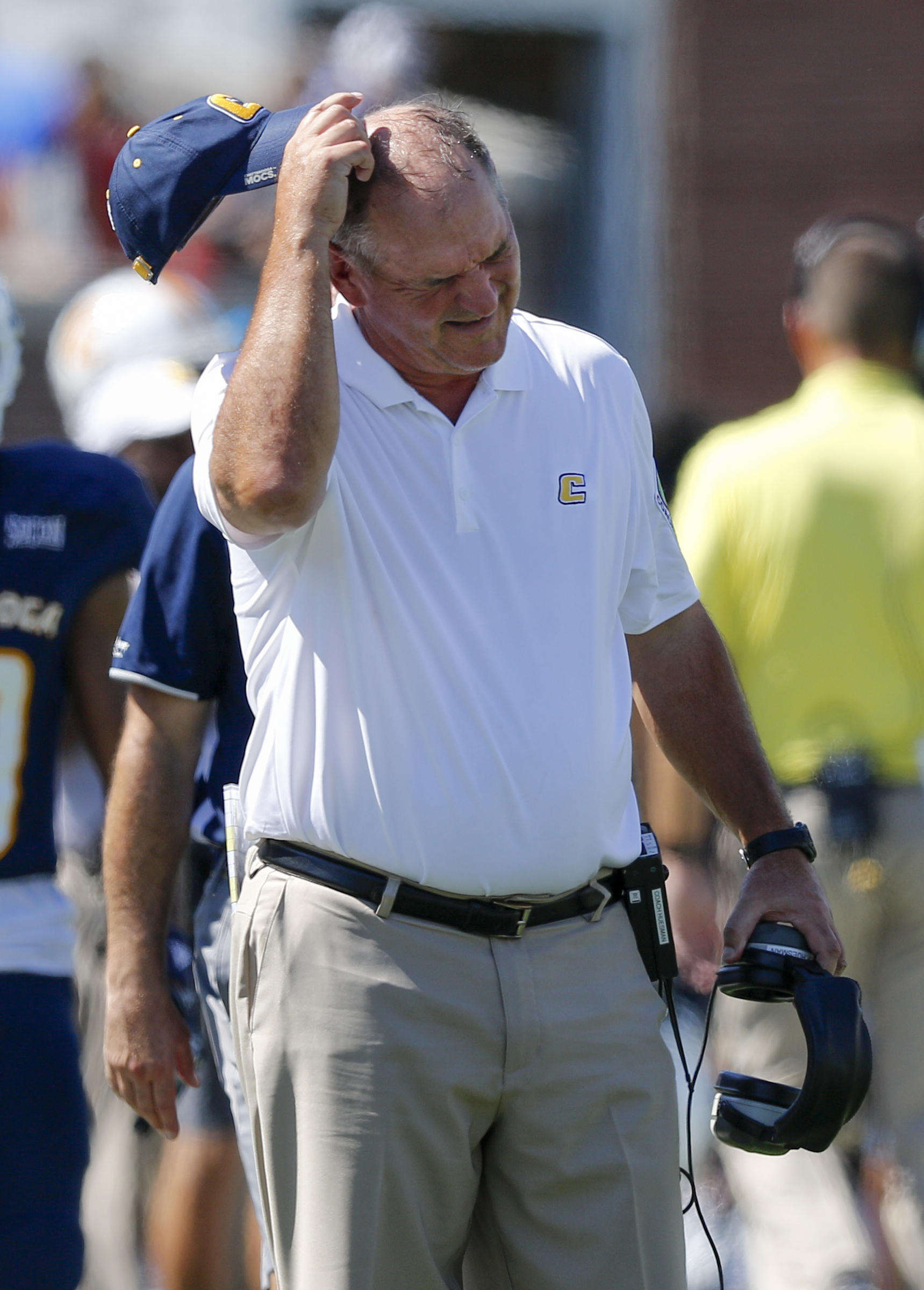UTC football coach Russ Huesman scratches his head on the sidelines during the Mocs' home football game against the Samford Bulldogs at Finley Stadium on Saturday, Sept. 24, 2016, in Chattanooga, Tenn.