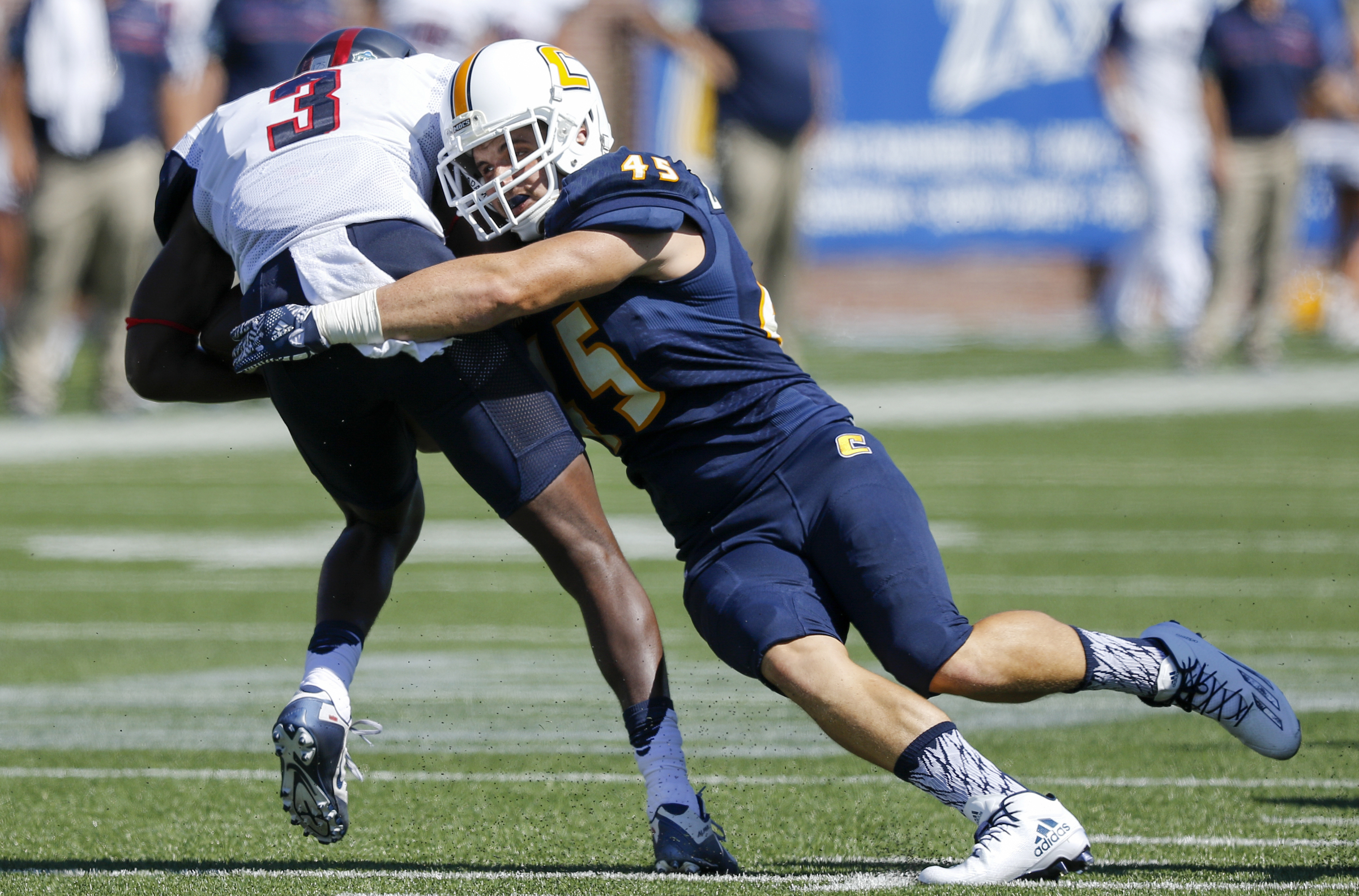 UTC linebacker Cody Bennett tackles Samford's Karel Hamilton during the Mocs' home football game against the Bulldogs at Finley Stadium on Saturday, Sept. 24, 2016, in Chattanooga, Tenn.