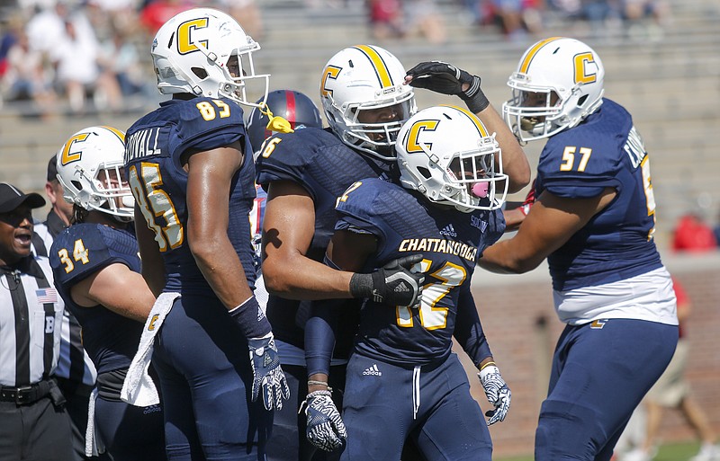 Teammates celebrate UTC wide receiver Xavier Borishade's (12) touchdown during the Mocs' home football game against the Bulldogs at Finley Stadium on Saturday, Sept. 24, 2016, in Chattanooga, Tenn.