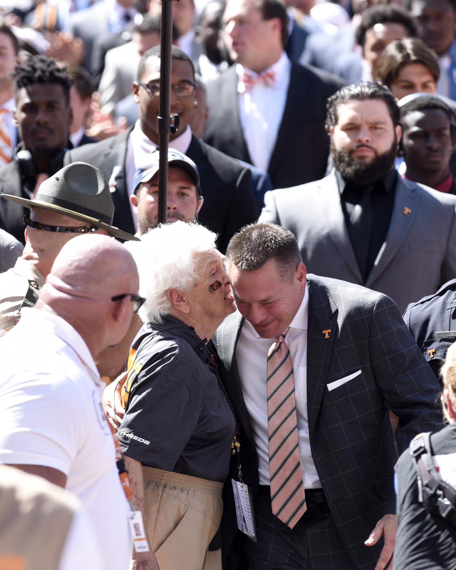 Tennessee head coach Butch Jones listens to a fan on his way down the Vol Walk. The Florida Gators visited the Tennessee Volunteers in a important SEC football contest at Neyland Stadium on September 24, 2016.