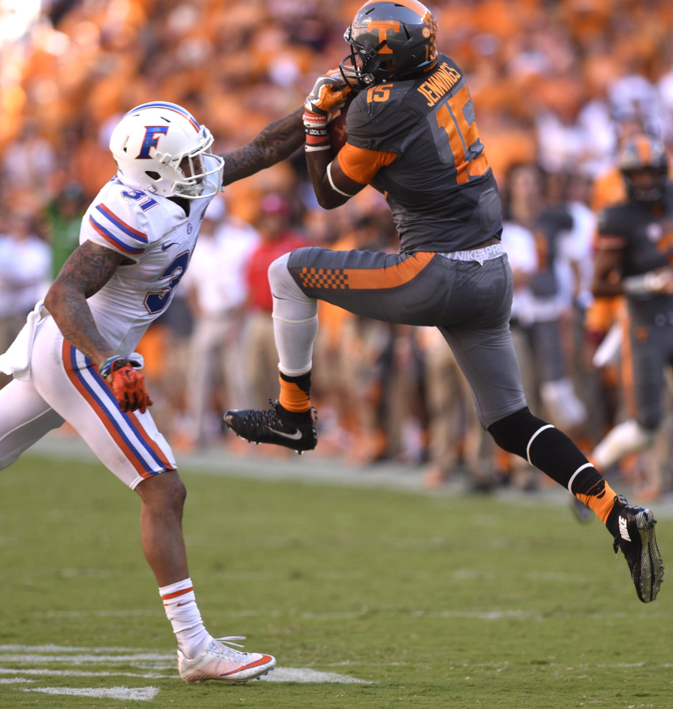 Tennessee's Jauan Jennings (15) pulls in a pass while Florida's Teez Tabor (31) defends. The Florida Gators visited the Tennessee Volunteers in a important SEC football contest at Neyland Stadium on September 24, 2016.