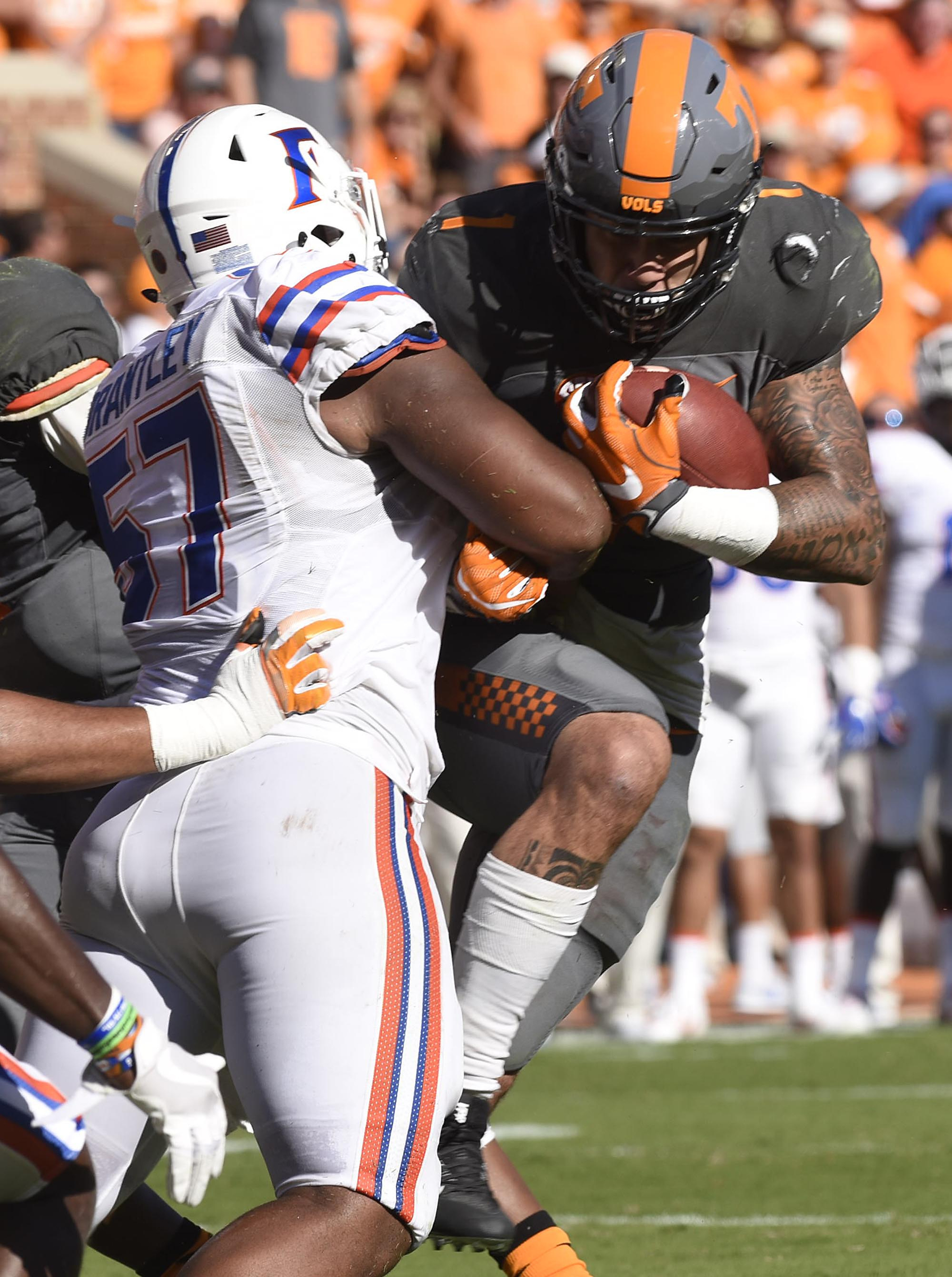 Tennessee's Jalen Hurd (1) is hit in the backfield for a loss by Florida's Caleb Brantley (57). The Florida Gators visited the Tennessee Volunteers in a important SEC football contest at Neyland Stadium on September 24, 2016.