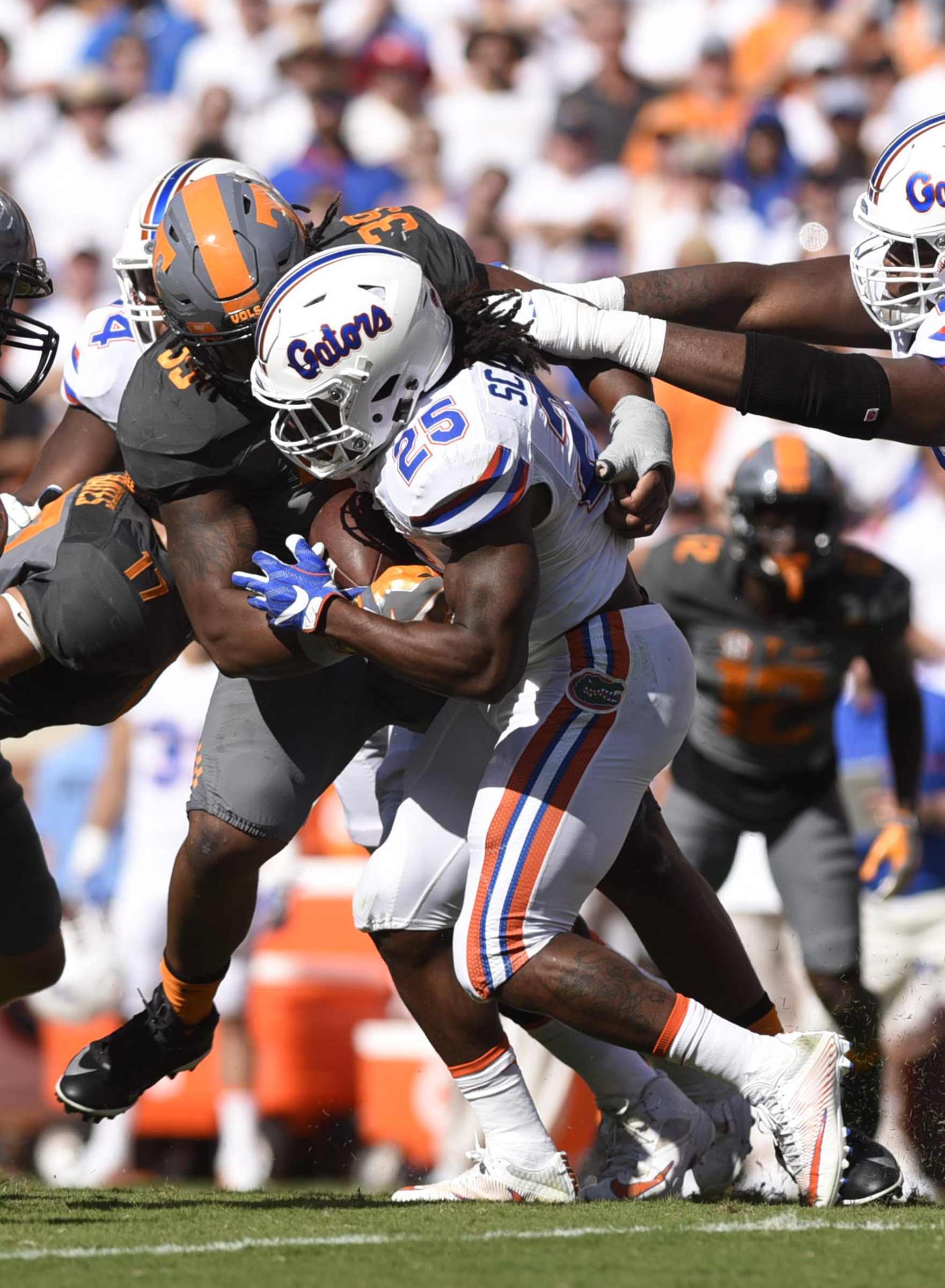 Tennessee's Kendal Vickers (39) tackles Florida's Jordan Scarlett (25). The Florida Gators visited the Tennessee Volunteers in a important SEC football contest at Neyland Stadium on September 24, 2016.