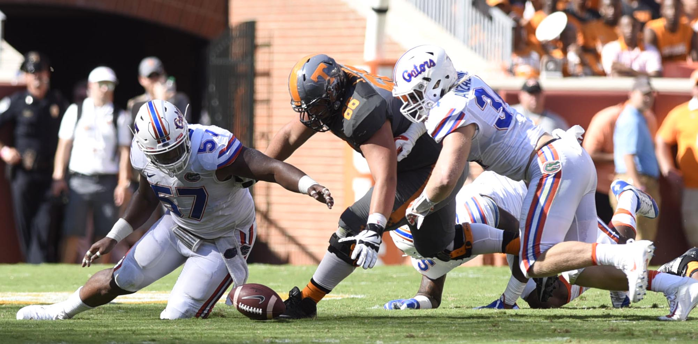 Tennessee's Jack Jones (66) and Florida's Caleb Brantley (57) and Alex Anzalone (34) go after a Joshua Dobbs fumble. The ball was ruled dead. The Florida Gators visited the Tennessee Volunteers in a important SEC football contest at Neyland Stadium on September 24, 2016.