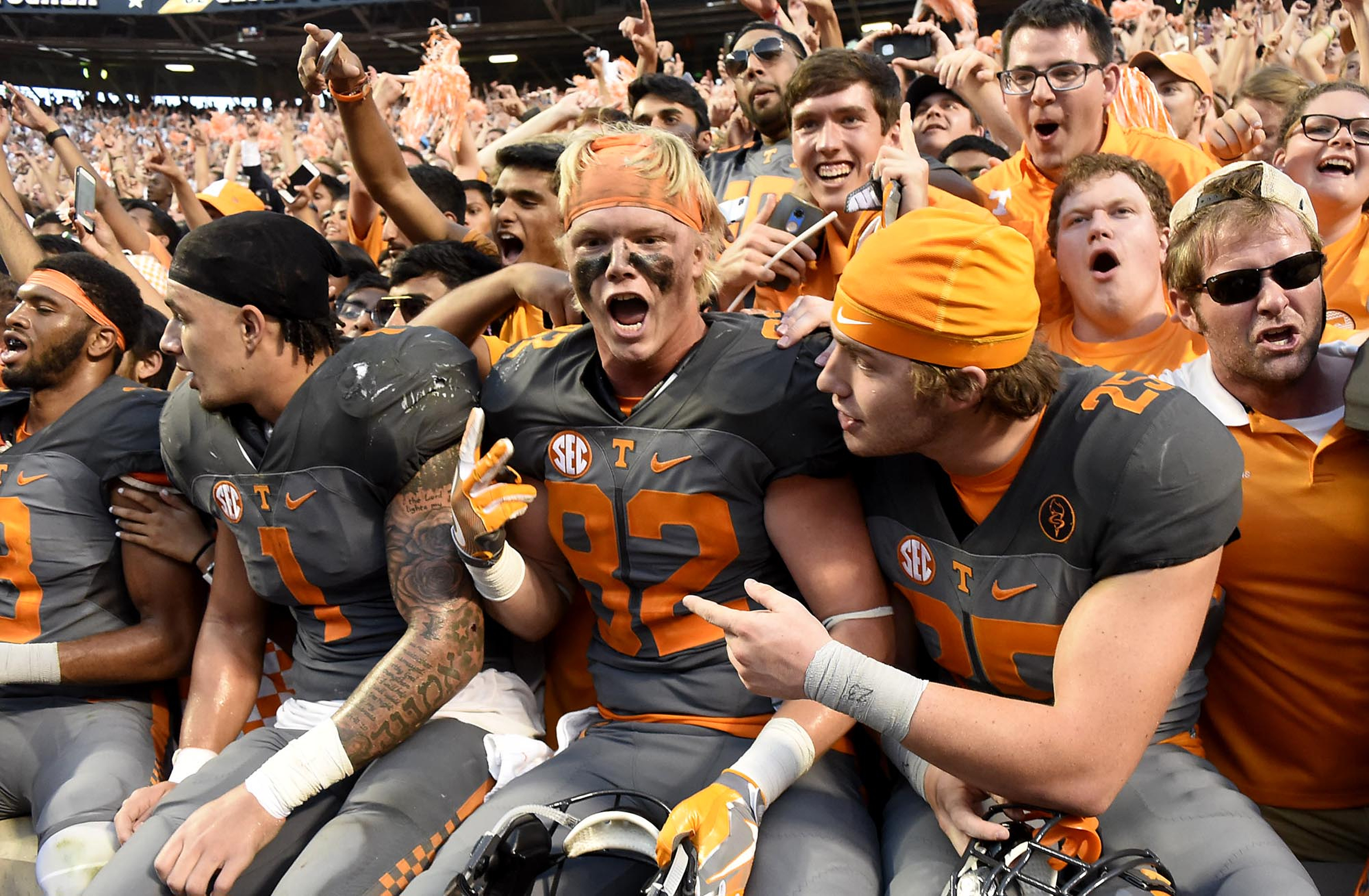 From left, Tennessee players Derek Barnett, Jalen Hurd, Ethan Wolf and Aaron Medley celebrate with fans after the game. The Florida Gators visited the Tennessee Volunteers in a important SEC football contest at Neyland Stadium on September 24, 2016.