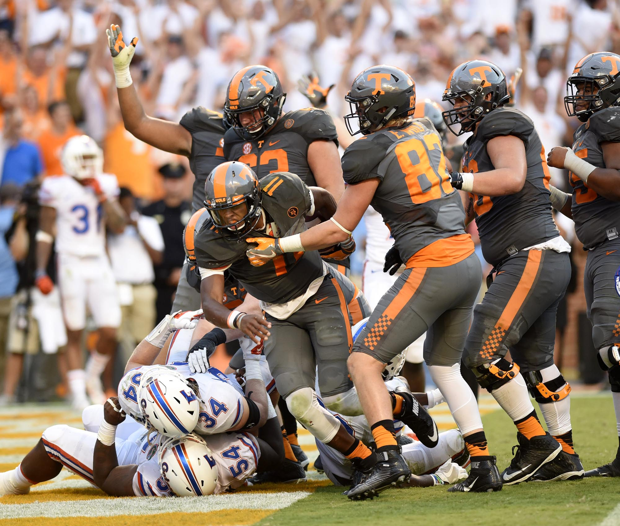 Tennessee's Joshua Dobbs (11) comes up from the pile after scoring Tennessee's last touchdown. The Florida Gators visited the Tennessee Volunteers in a important SEC football contest at Neyland Stadium on September 24, 2016.