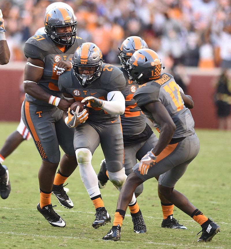 The Tennessee defense surrounds Todd Kelly Jr. (24) as he comes up with an interception.  The Florida Gators visited the Tennessee Volunteers in a important SEC football contest at Neyland Stadium on September 24, 2016.