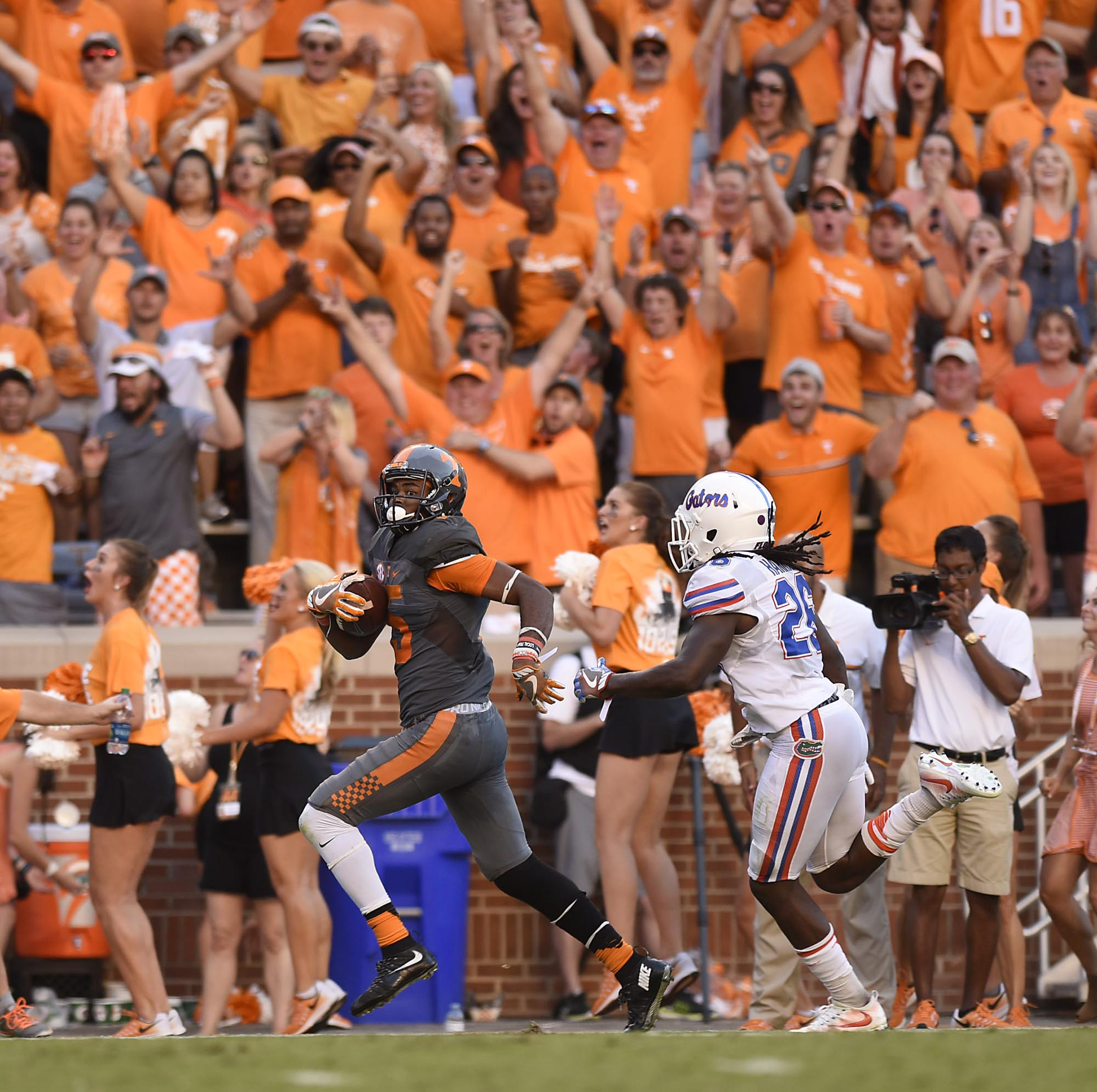 The crowd erupts as Tennessee's Jauan Jennings (15) outruns Florida's Marcell Harris (26) for Tennessee's go-ahead touchdown. The Florida Gators visited the Tennessee Volunteers in a important SEC football contest at Neyland Stadium on September 24, 2016.