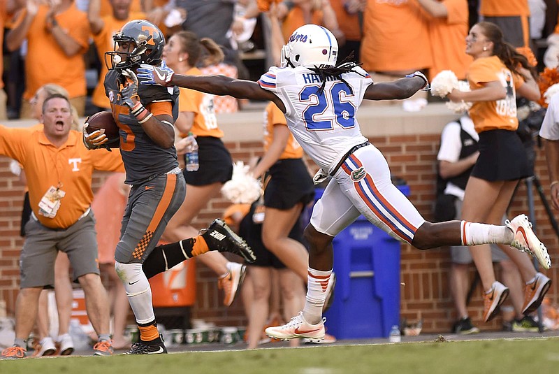 Tennessee's Jauan Jennings (15) outruns Florida's Marcell Harris (26) for a touchdown that would put Tennessee ahead 24-21.  The Florida Gators visited the Tennessee Volunteers in a important SEC football contest at Neyland Stadium on September 24, 2016.