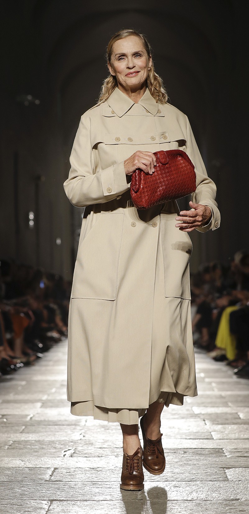 
              Model and actress Lauren Hutton wears a creation for the Bottega Veneta women's Spring-Summer 2017 collection, presented in Milan, Italy, Saturday, Sept. 24, 2016. (AP Photo/Luca Bruno)
            