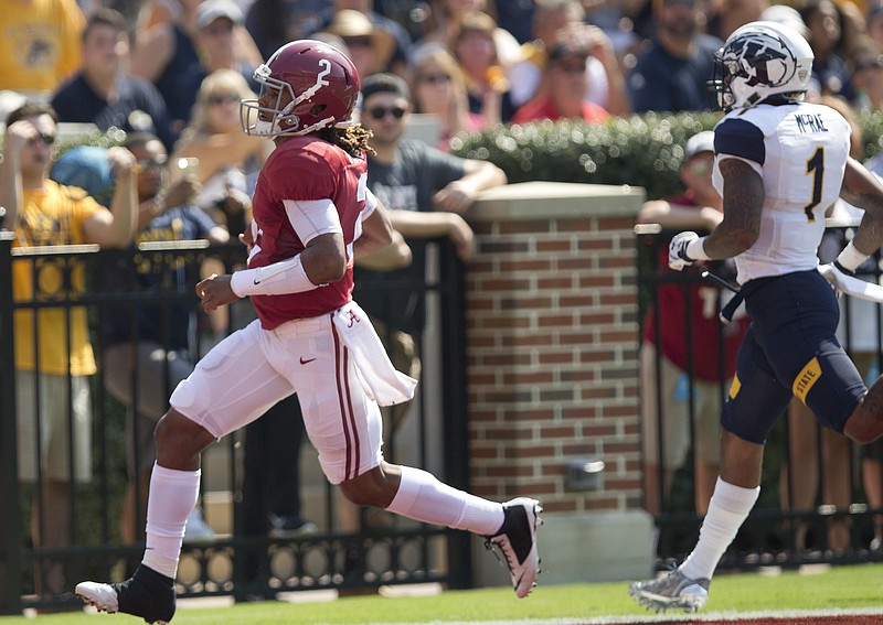 Alabama quarterback Jalen Hurts runs the ball in for a touchdown in the first half during an NCAA college football game against Kent State, Saturday, Sept. 24, 2016, in Tuscaloosa, Ala. (AP Photo/Brynn Anderson)