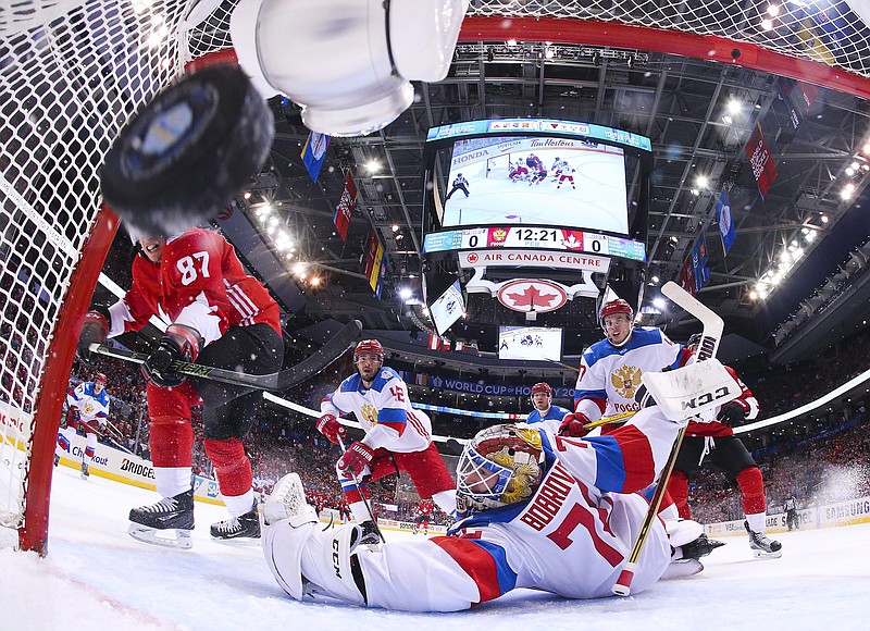 
              Team Canada's Sidney Crosby (87) scores on Team Russia's goalie Sergei Bobrovsky (72)  during the first period of a World Cup of Hockey semifinal game, Saturday, Sept. 24, 2016 in Toronto. (AP Photo/Bruce Bennett, Pool)
            